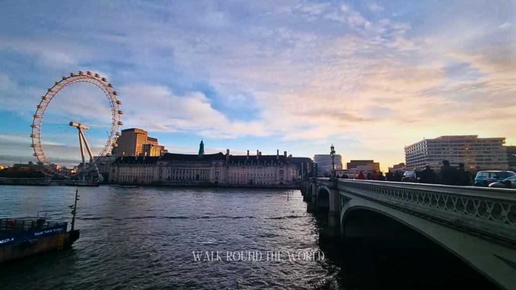 Sunrise view of the River Thames from the North Bank in London, featuring the London Eye and Westminster Bridge