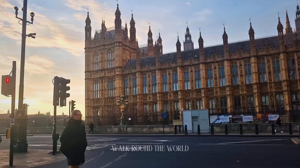 Westminster Palace at sunrise in London with an empty road in the foreground, capturing a quiet early morning atmosphere