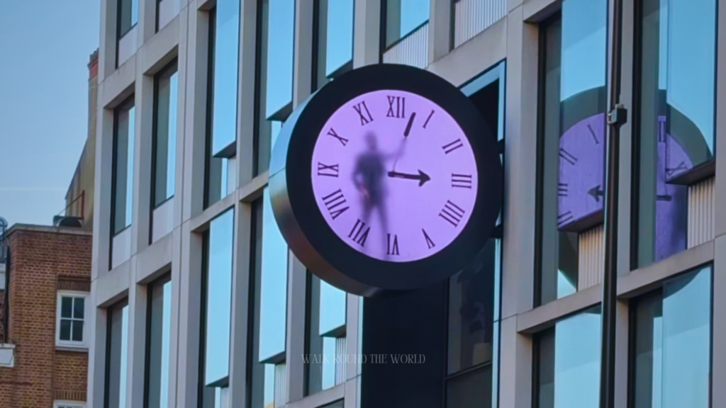 The picture of man trapped inside clock at paddington station