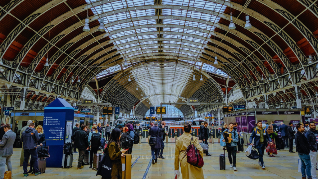 Interior view of Paddington Station iron arches and glass roof in London