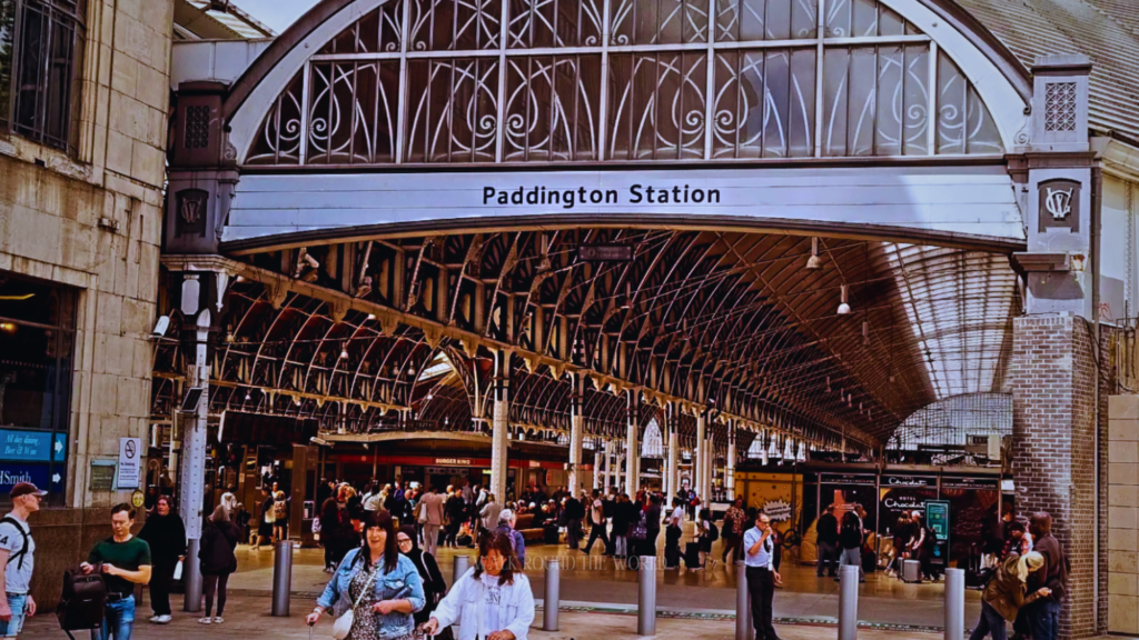 Passengers waiting on platform inside Paddington Station London