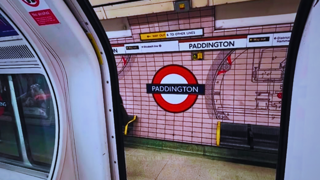 London Underground train arriving at Paddington station platform