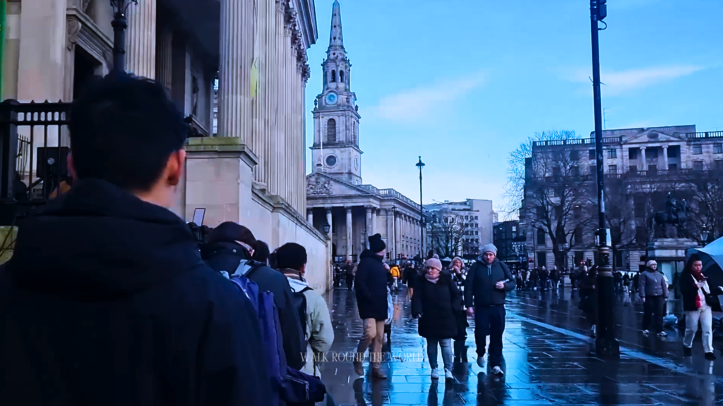 Visitors walking through Trafalgar Square towards National Gallery London