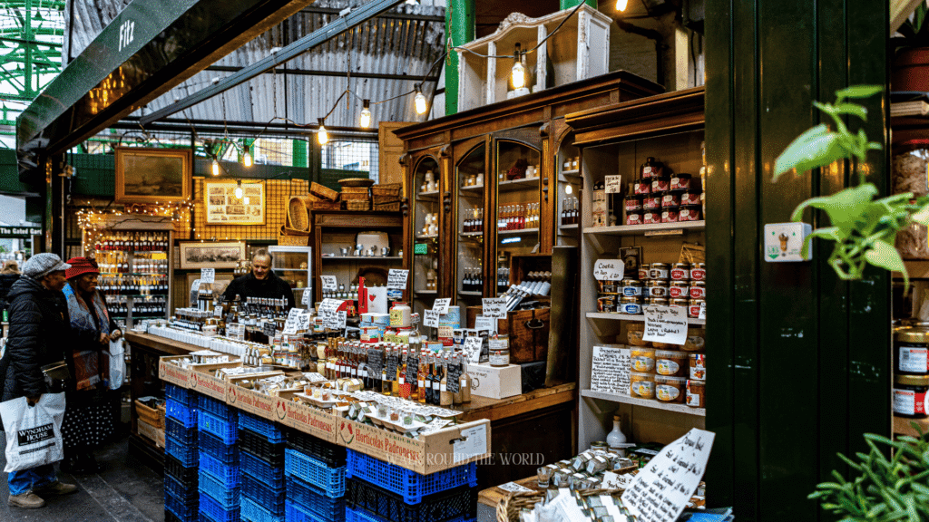 Street food stalls and fresh produce vendors inside Borough Market London