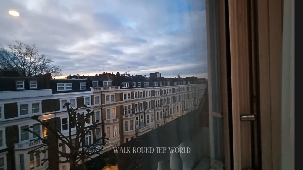Early morning pre-sunrise view of Earl’s Court from a hotel window in London showing quiet streets and soft dawn light