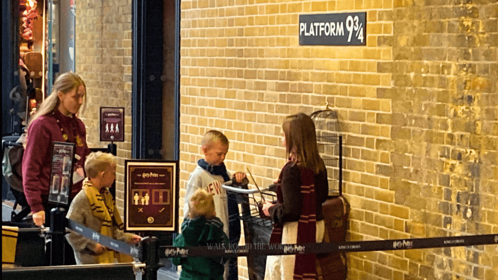 Platform 9¾ trolley disappearing into the wall at King’s Cross Station London