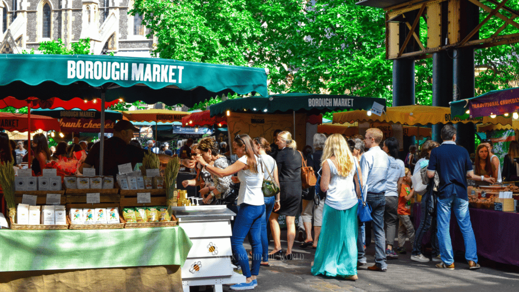 Food stalls and summer crowd inside Borough Market London