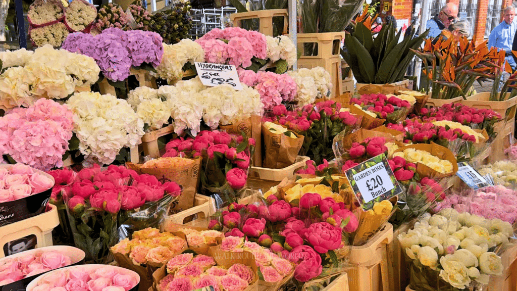 Flowers and crowds at Columbia Road Flower Market in London during summer