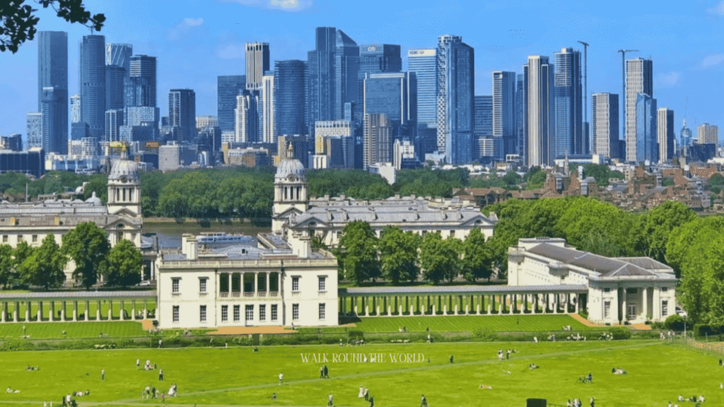 Visitors enjoying a sunny June day in Greenwich Park, London, with lush greenery and clear summer skies.