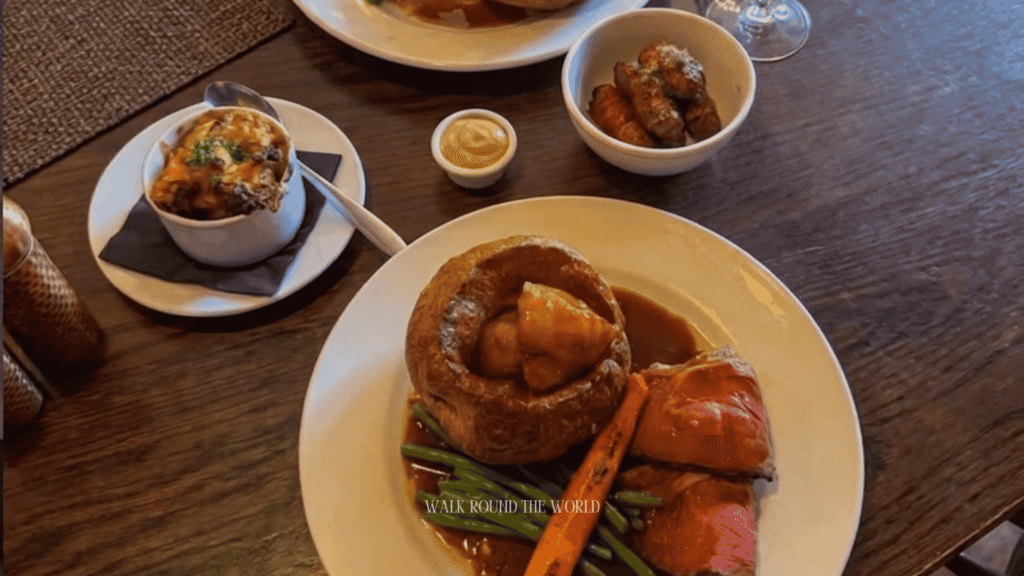 Traditional Sunday Roast served in a historic London pub with roast beef, Yorkshire pudding, roast potatoes, seasonal vegetables and rich gravy.
