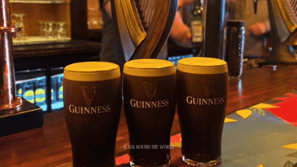 Pint of Guinness served inside a traditional Central London pub with a classic wooden bar and authentic British pub atmosphere.