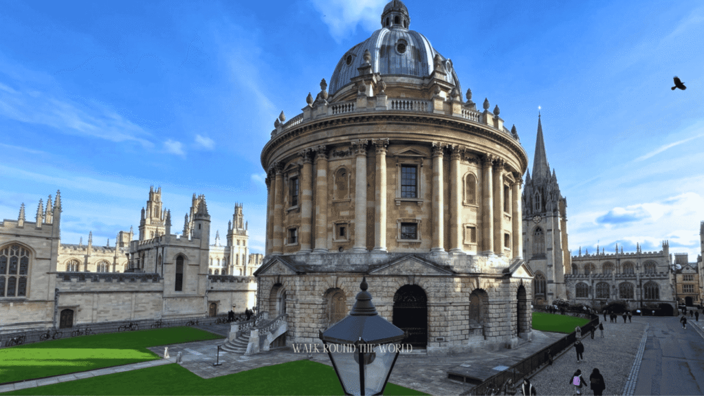 Tourists exploring Radcliffe Square and the iconic Radcliffe Camera in Oxford during a day trip from London.