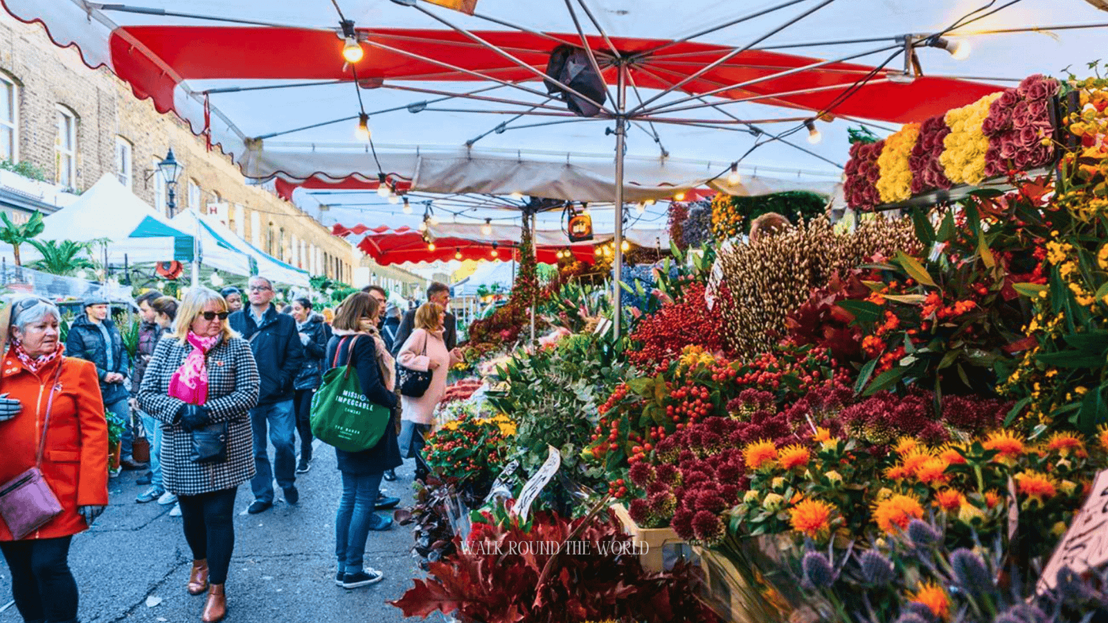 Columbia Road Flower Market London on Sunday with colourful flowers and busy market stalls