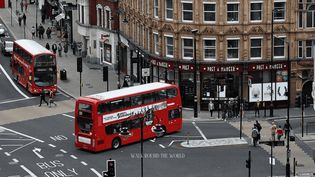 Red double-decker London bus on a city street