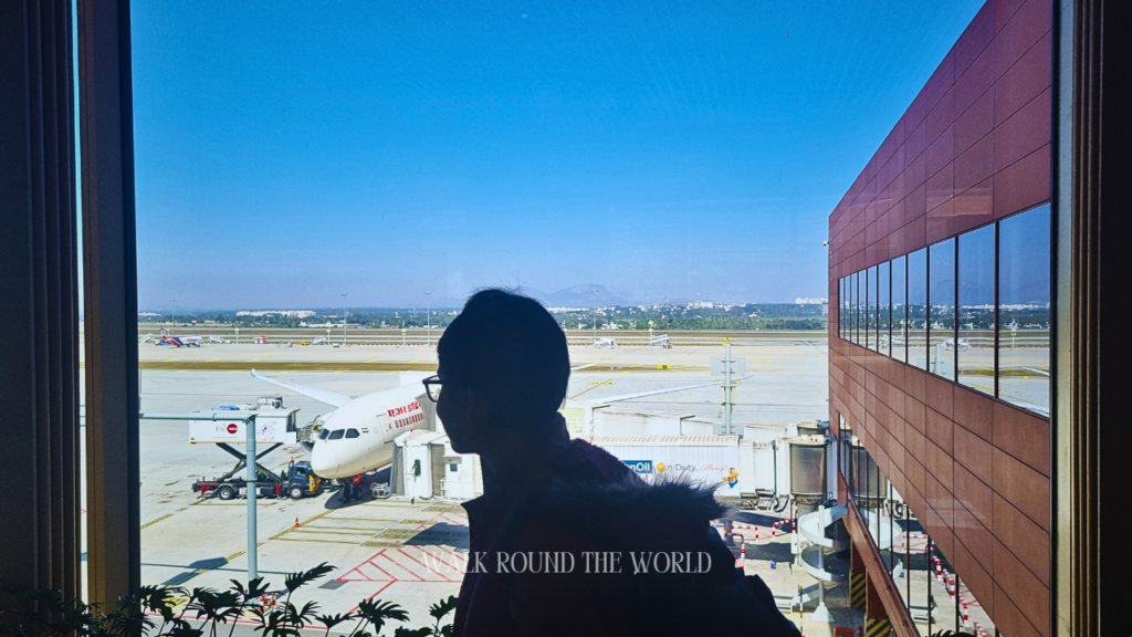 Air India flight AI 133 undergoing inspection seen through the glass at Gate C, Terminal 2, Kempegowda International Airport, Bangalore