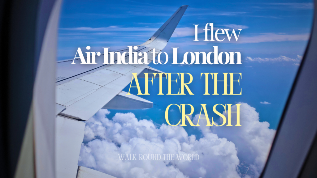 Air India aircraft wing seen from a window seat above the clouds during the Bangalore to London flight